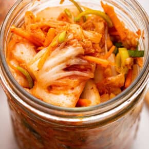 Top-down view of kimchi recipe in glass jar