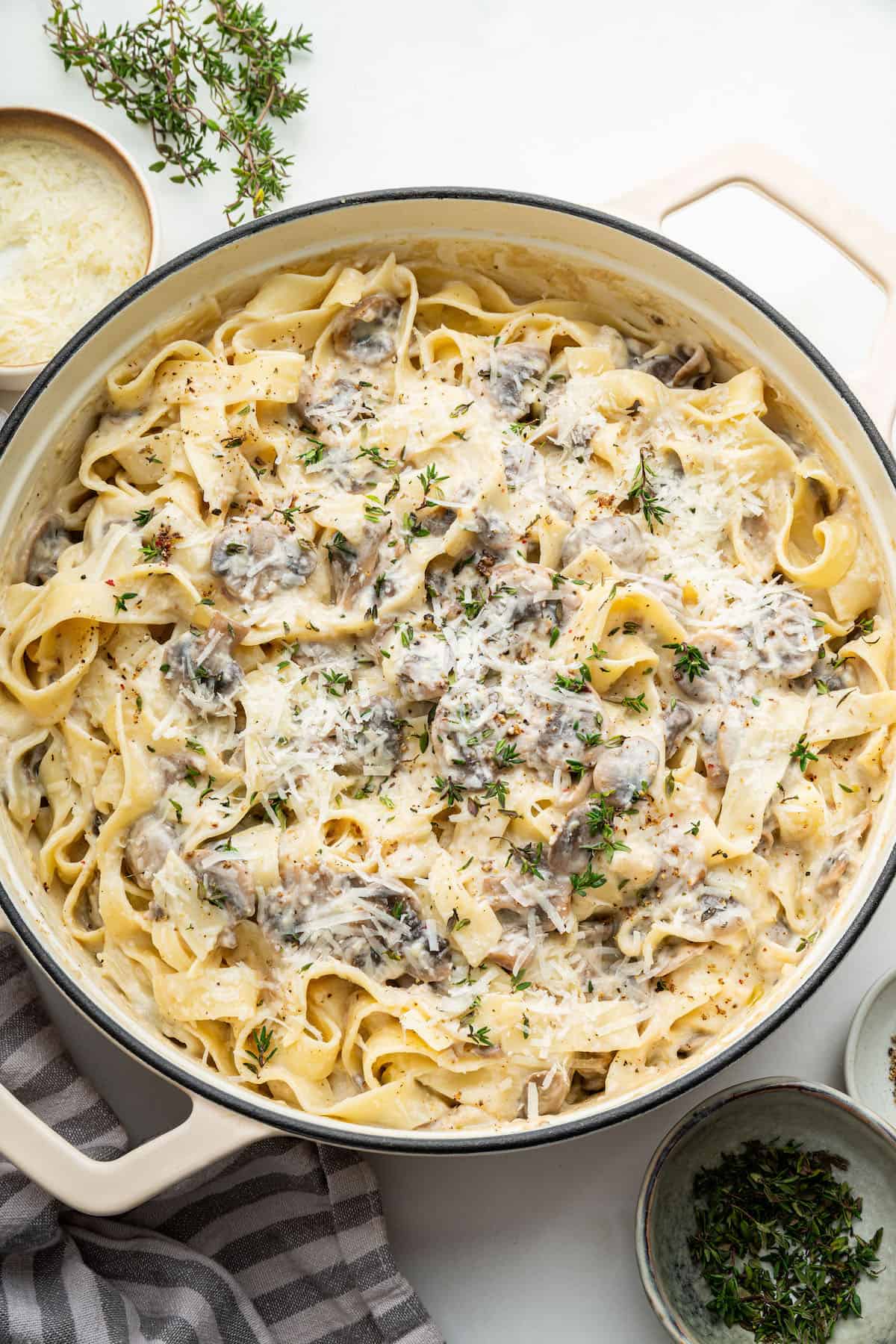 Overhead view of creamy mushroom pasta in pan