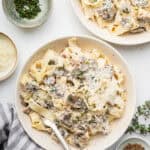 Overhead view of creamy mushroom pasta in two bowls