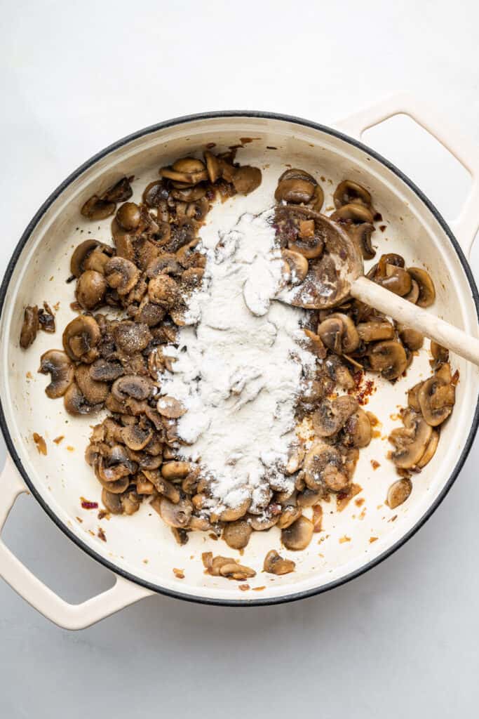 Flour added to pan of mushrooms