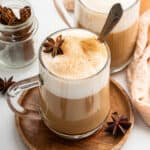 Two dirty chai lattes in glass mugs