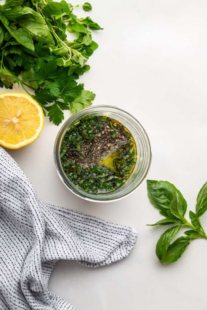 Overhead view of ingredients for Italian dressing in jar