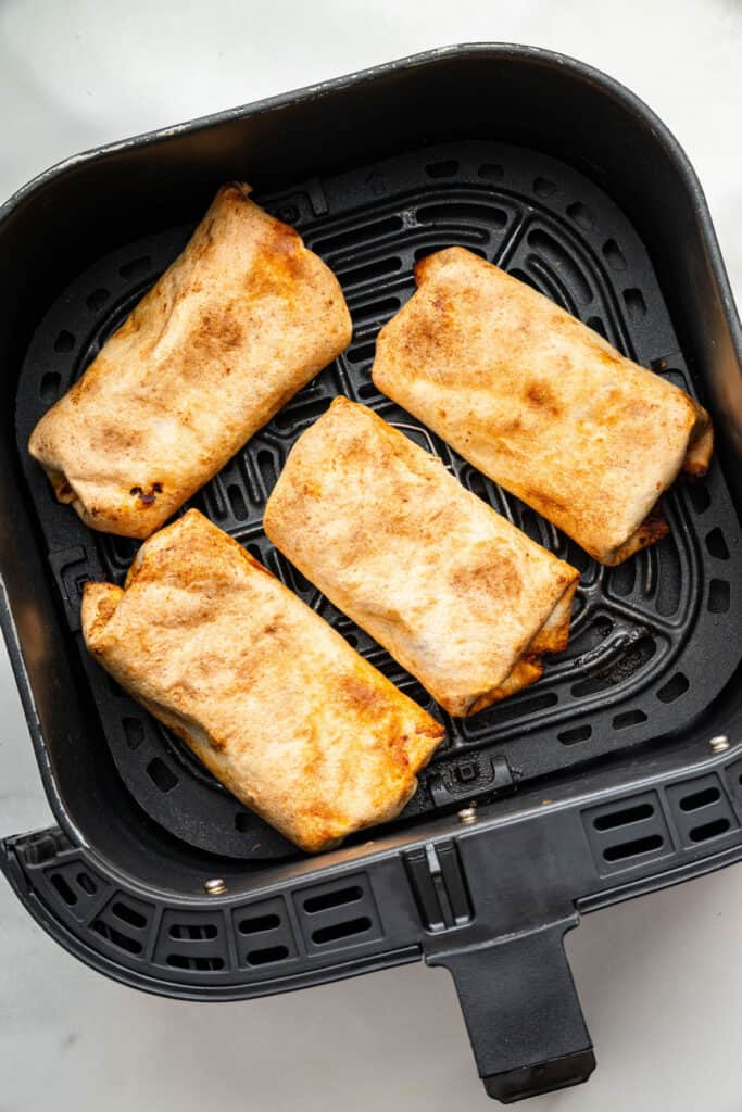 Air fryer basket with chimichangas