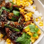 Chicken bulgogi in bowl with rice and corn