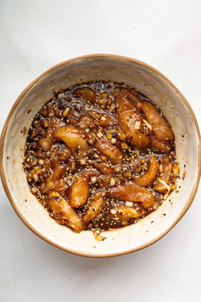 Overhead view of chicken bulgogi marinating in bowl