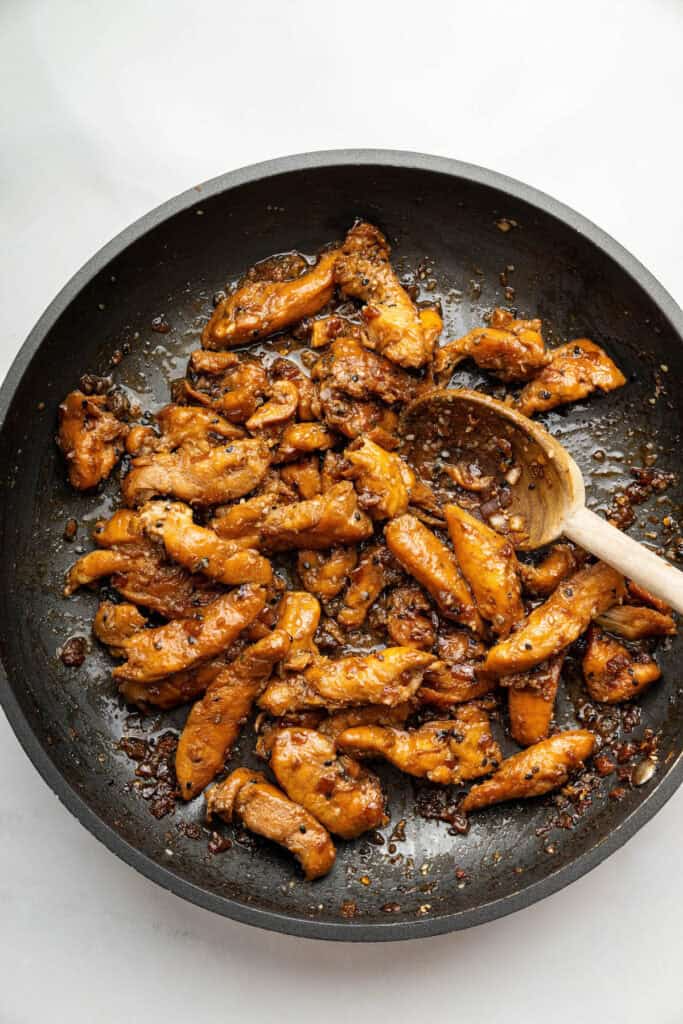 Overhead view of chicken bulgogi cooking in skillet