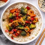 Tofu stir fry in bowl of rice