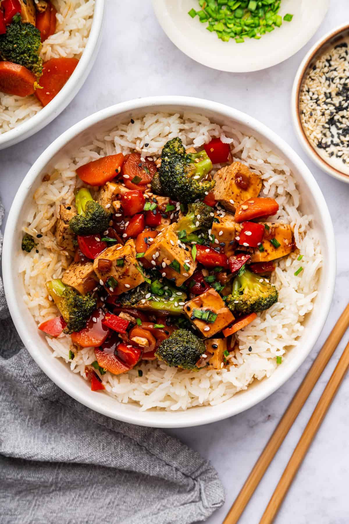 Tofu stir fry in bowl of rice