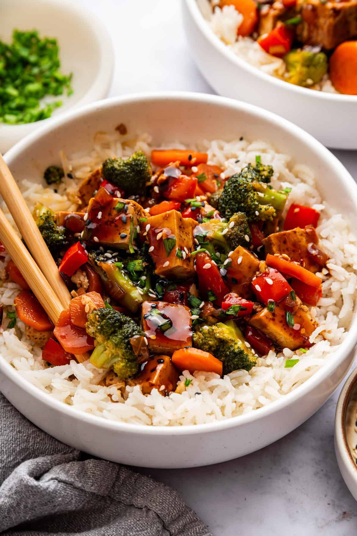 Tofu stir fry in bowl with rice