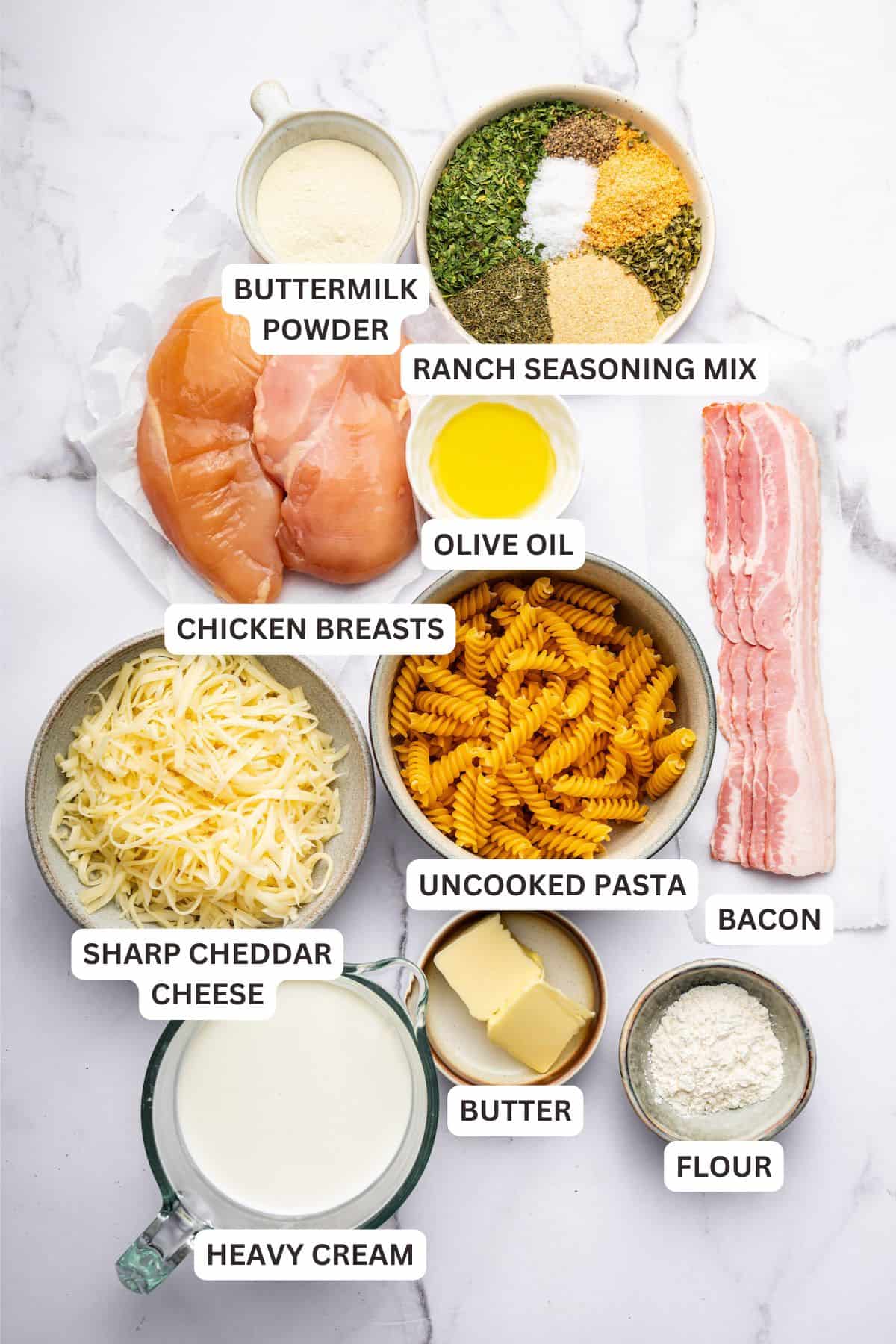 Overhead view of ingredients for chicken bacon ranch pasta with labels