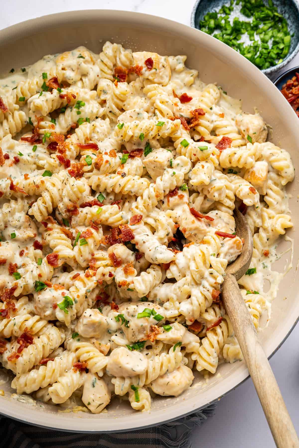 Creamy chicken bacon ranch pasta in serving bowl