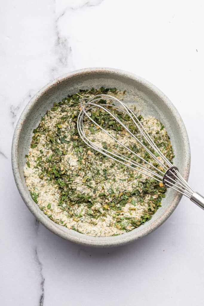 Ranch seasoning in bowl with whisk