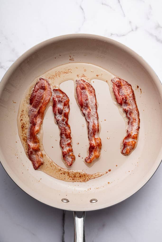 Bacon cooking in skillet